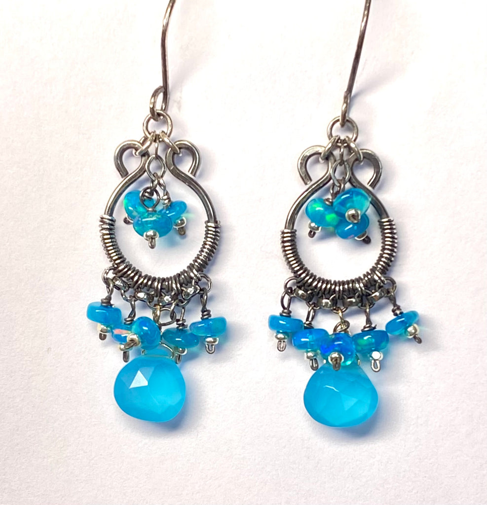 Pair of blue beaded earrings on a white background