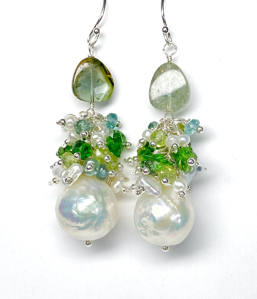 A pair of earrings featuring baroque edison pearls, green gemstone clusters, and tourmaline pendant drops, mounted on sterling silver.
