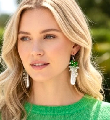  (Blonde model closeup in green sweater): White Biwa pearl chrome diopside opal cluster earrings on blonde model in green sweater closeup - sterling silver