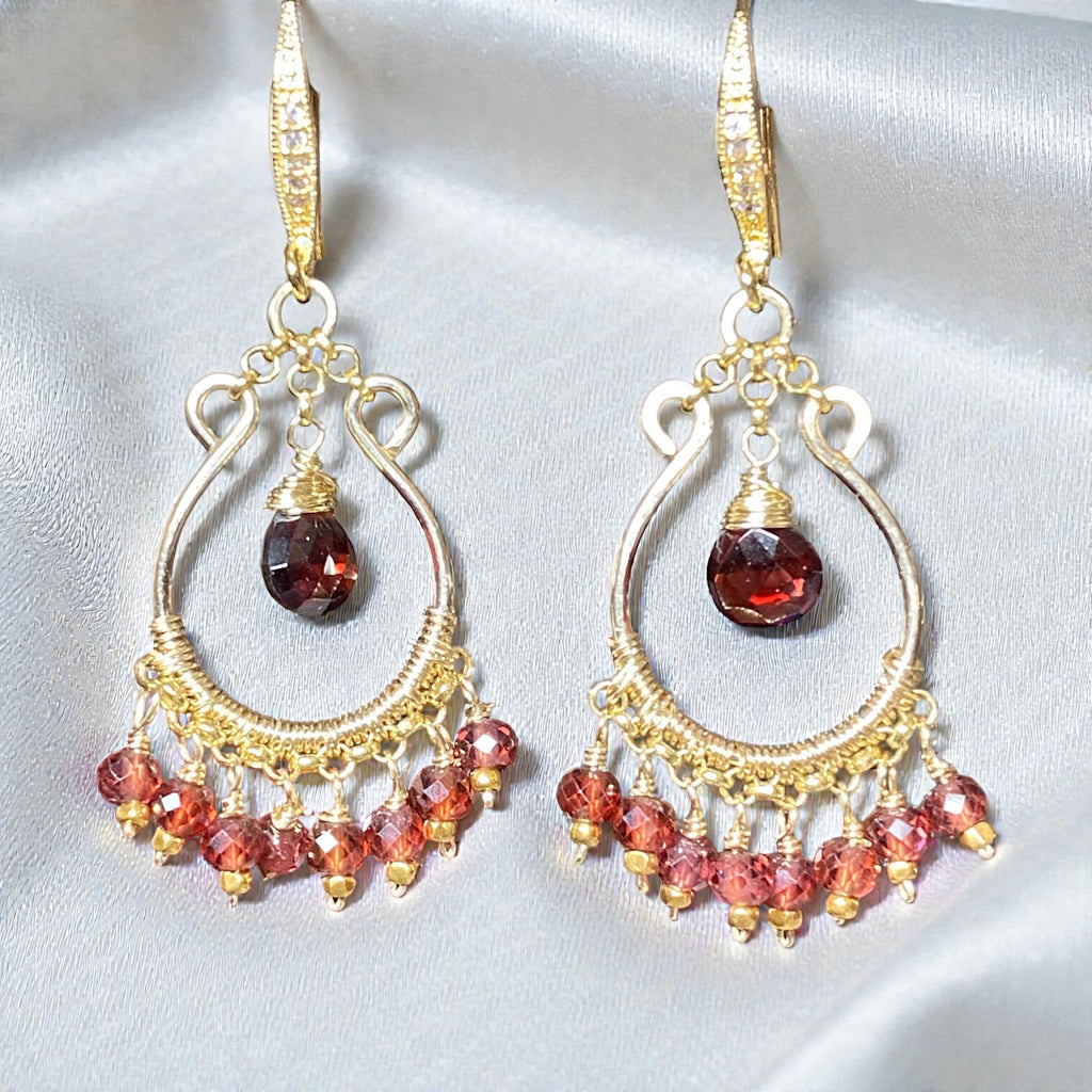 Red garnet chandelier hoop earrings 14kt gold fill on white silk fabric