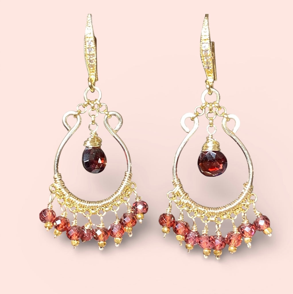Red garnet chandelier hoop earrings 14kt gold fill against blush pink background