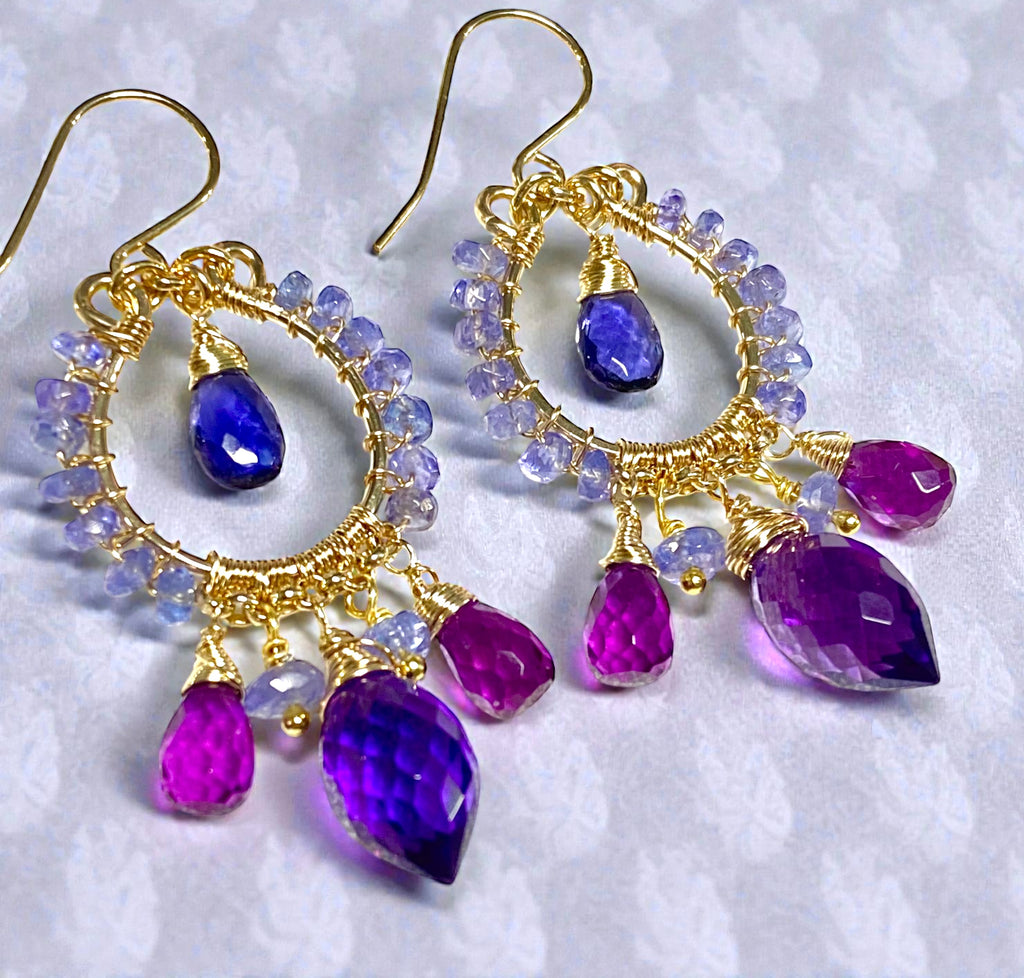 Tanzanite iolite amethyst violet quartz gold filled chandelier earrings on lavender patterned surface showing purple blue gemstone coordination