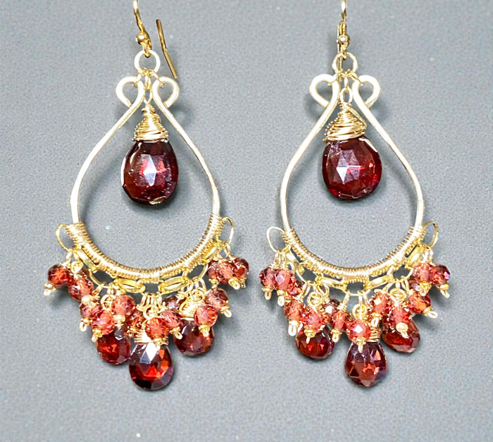Red garnet chandelier earrings 14kt gold fill on grey background