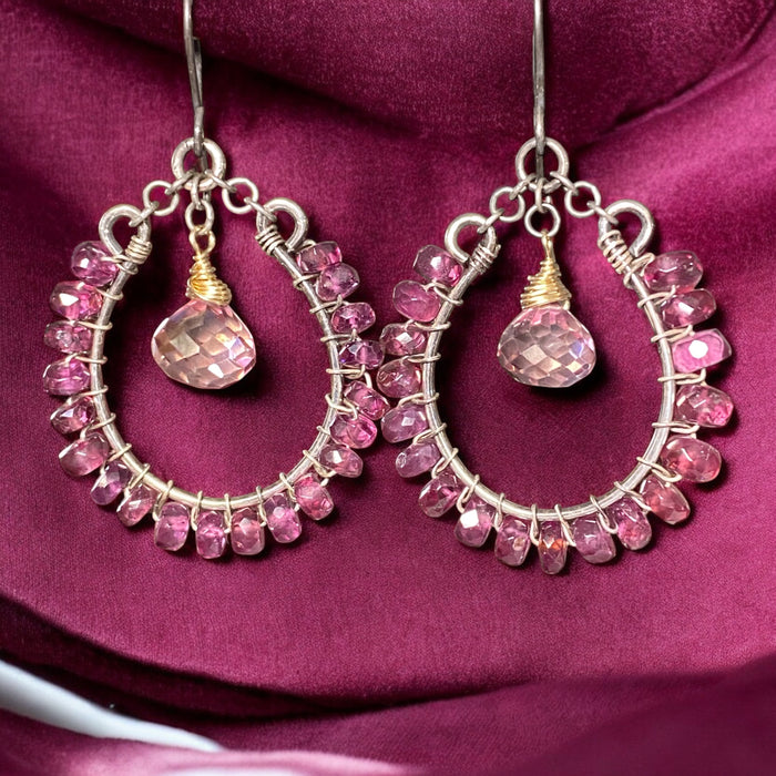 Rhodolite garnet hoop earrings mixed metals mystic plum pink topaz 14kt gold fill oxidized sterling silver against burgundy velvet draped backdrop