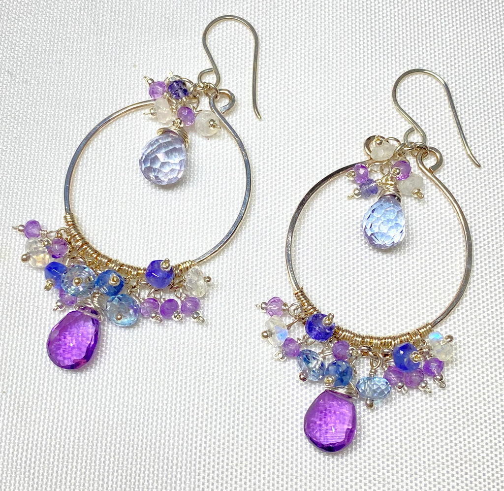 Colorful gemstone chandelier earrings amethyst tanzanite blue violet quartz on plain white background