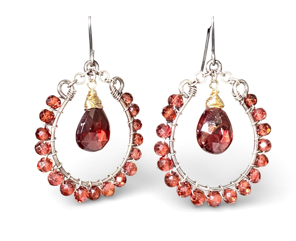 Red garnet hoop earrings mixed metals oxidized sterling silver and 14kt gold fill on plain white background studio shot