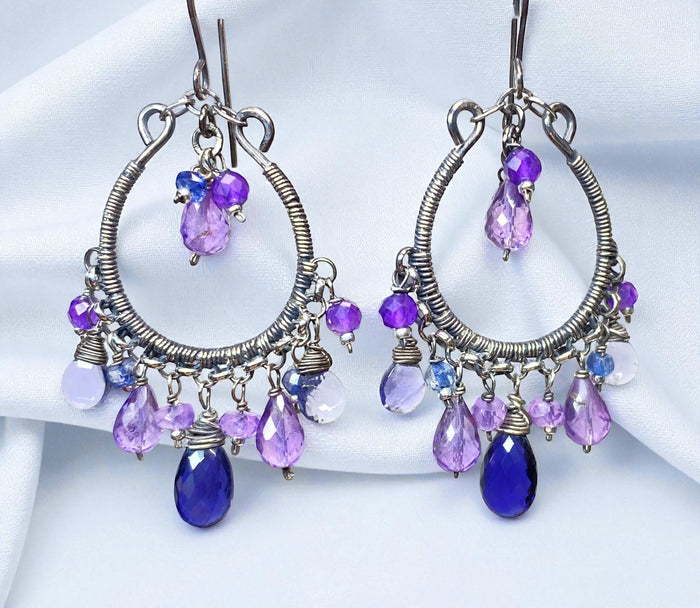Oxidized sterling silver chandelier hoops with lavender amethyst center drops and a fringe of deep blue iolite, lavender teardrops and purple gemstone beads.