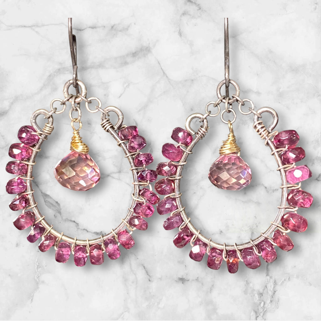 Rhodolite garnet hoop earrings mixed metals mystic plum pink topaz 14kt gold fill oxidized sterling silver against mottled white black grey marble