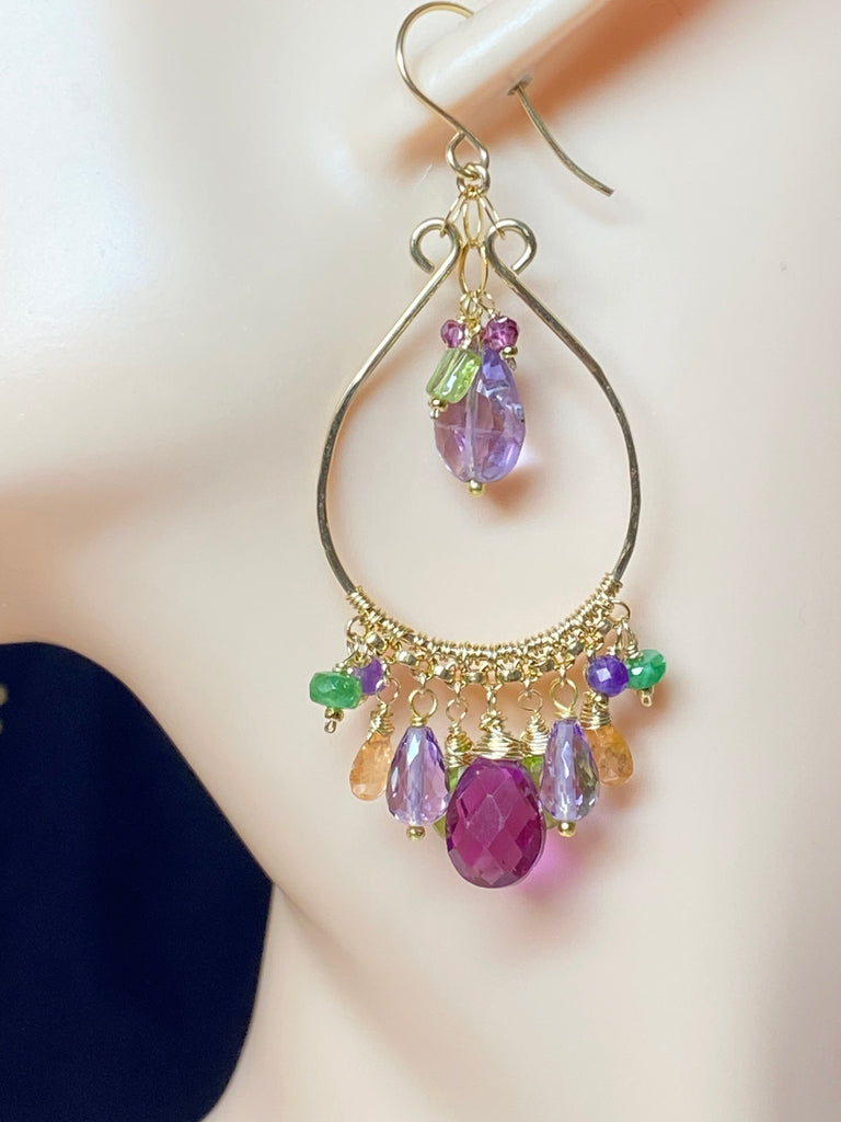 Earring dangling from mannequin head ear to show size.
