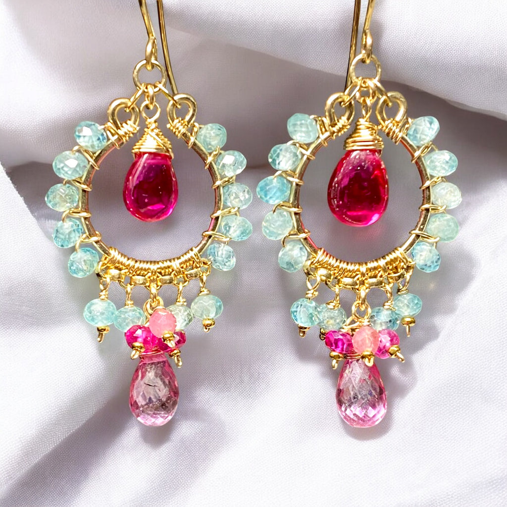 "Natural blue zircon and pink gemstone chandelier hoop earrings in 14K gold fill displayed against draped white fabric"