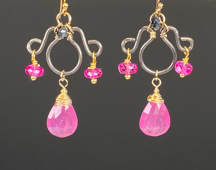 Pink sapphire chandelier earrings with fuchsia sapphire accents, mystic black spinel and oxidized sterling silver frames wrapped in gold-filled wire.