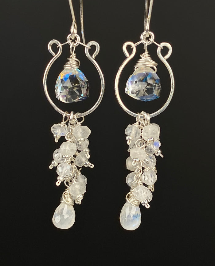 Rainbow quartz trillions inside sterling silver hoop forms, with cascading moonstone and white zircon tassels ending in moonstone teardrops.