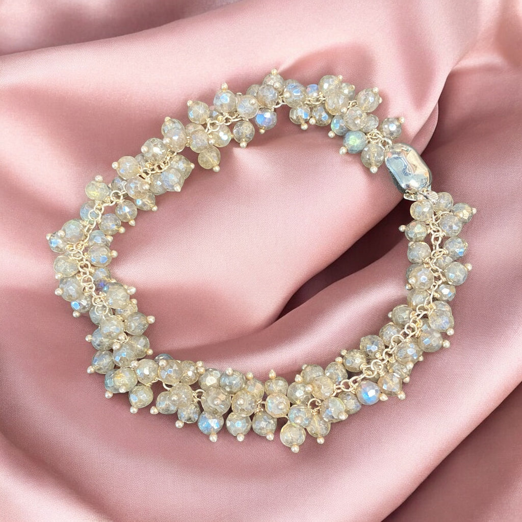 : Mystic labradorite sterling silver cluster bracelet on draped pink blush fabric