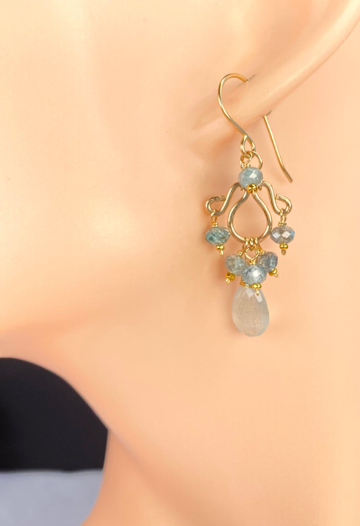 Petite moss aquamarine and blue zircon chandelier earring shown on a display ear, illustrating its French hook and compact gold-filled design.