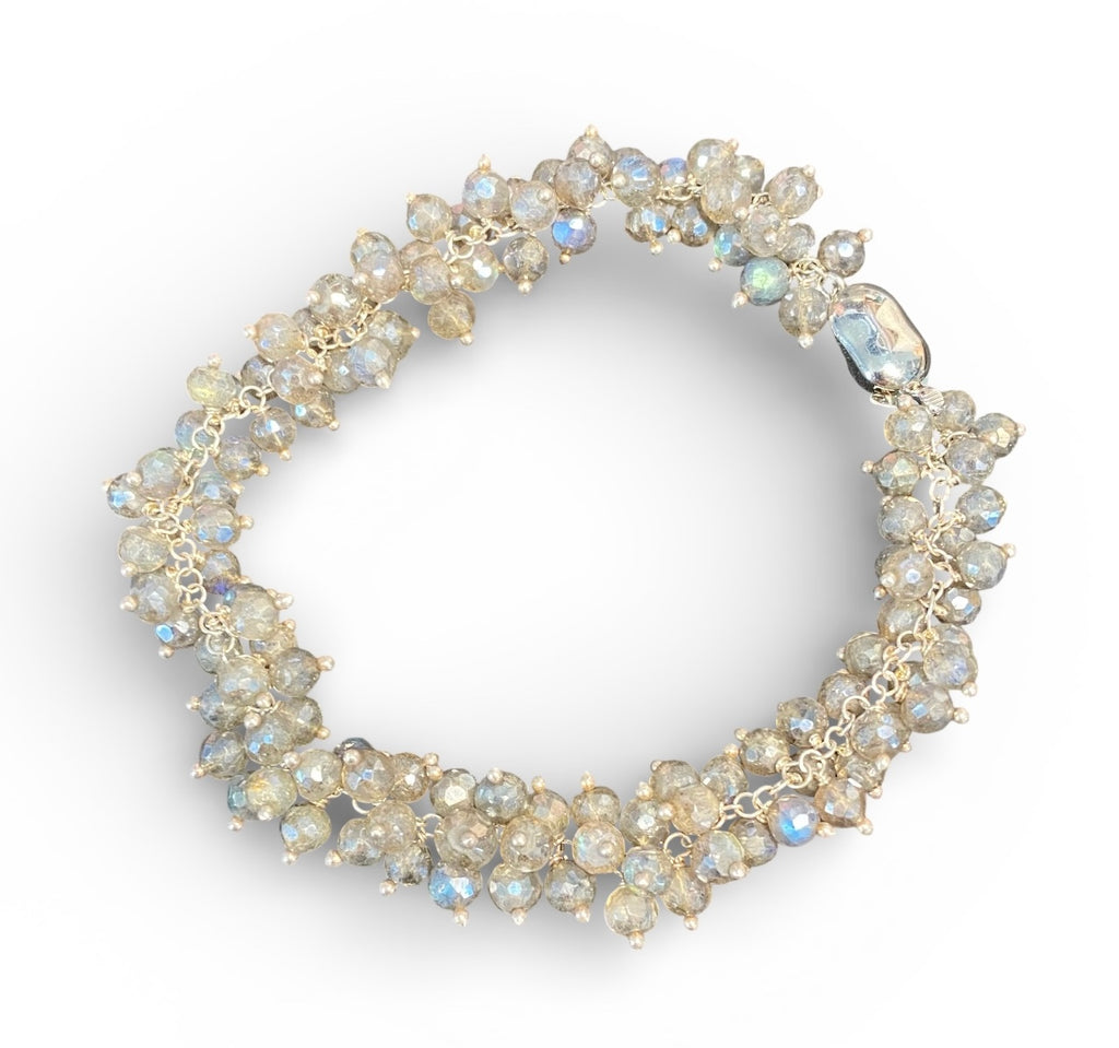 Mystic labradorite sterling silver cluster bracelet on plain white background