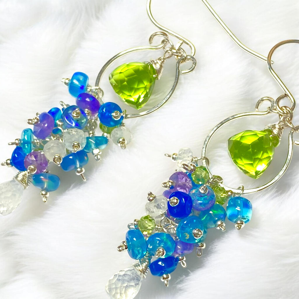 peridot, pink amethyst and moonstone chandelier hoop earrings with opal rondelles in sterling silver on white fabric