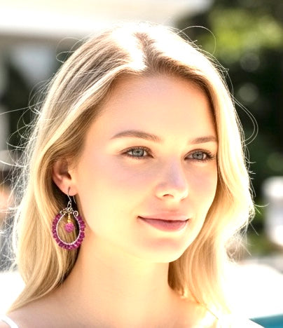 Rhodolite garnet hoop earrings mixed metals mystic plum pink topaz 14kt gold fill oxidized sterling silver worn by blonde model in white dress pool background