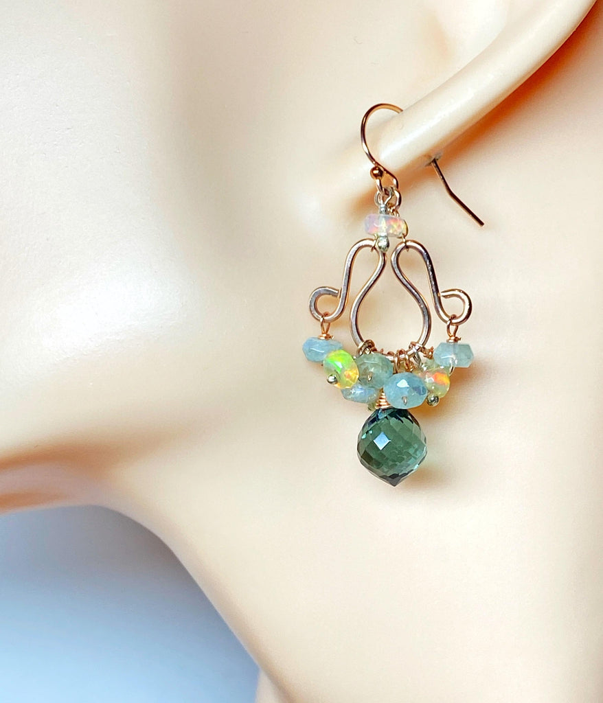 Opal aquamarine rose gold chandelier earrings on mannequin head