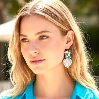 (Blonde model in turquoise shirt closeup): Rainbow moonstone opal cluster earrings on blonde model in turquoise shirt closeup - gold fill