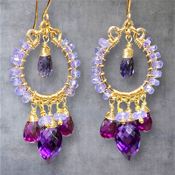 Tanzanite iolite amethyst violet quartz gold filled chandelier earrings on grey suede background showing December birthstone jewelry