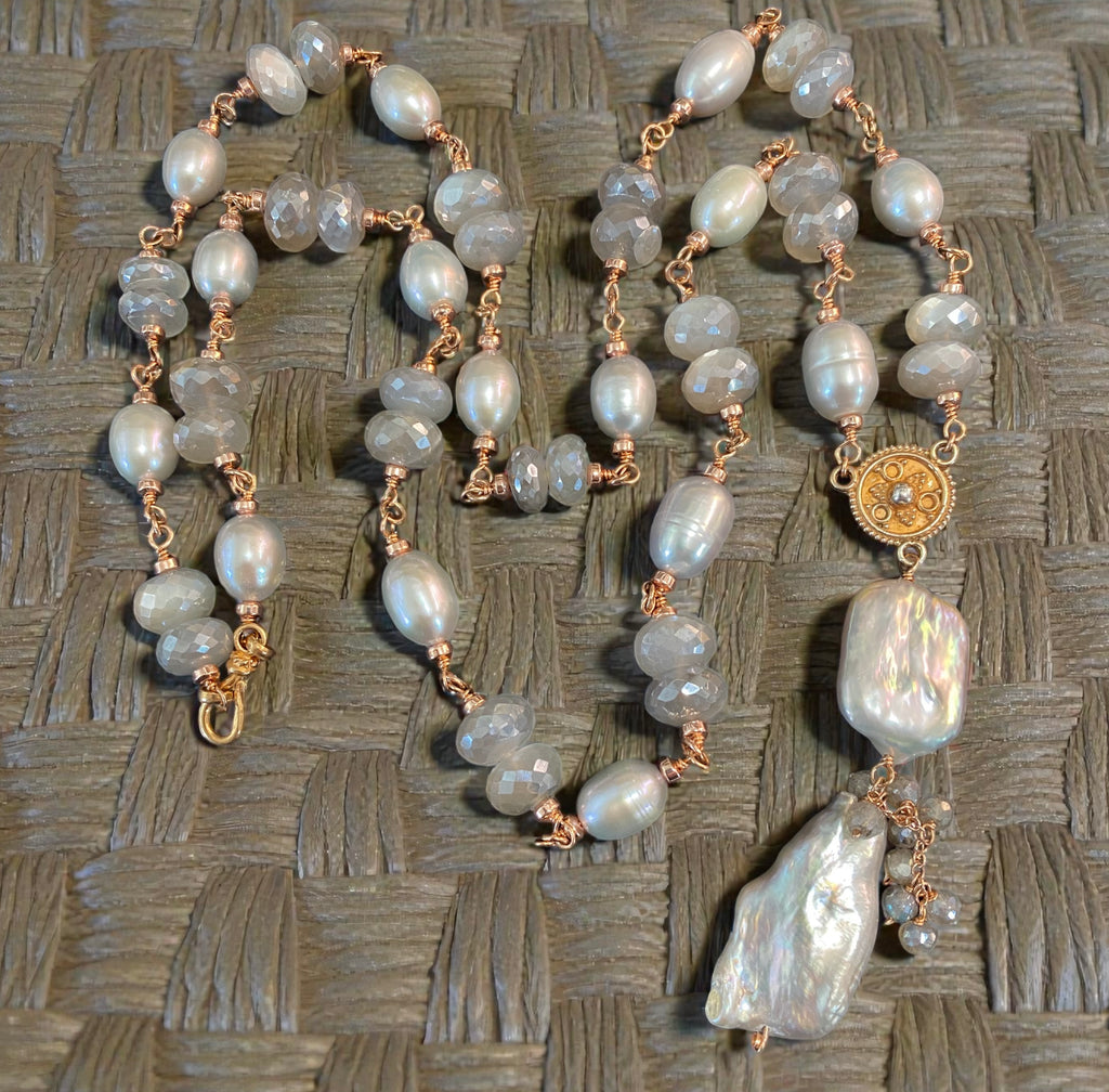 Handmade rose gold grey baroque pearl moonstone necklace on taupe woven fabric