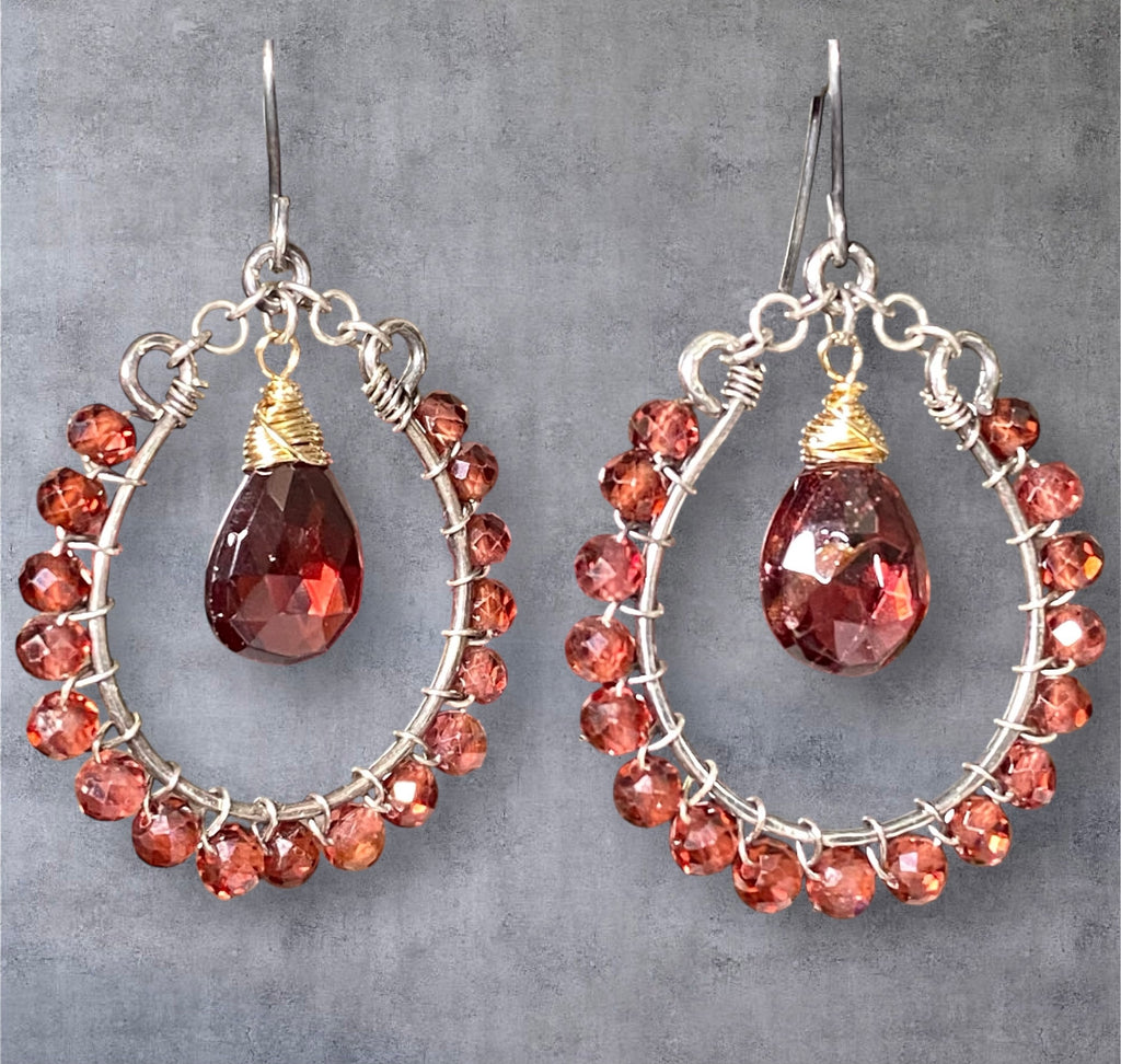Red garnet hoop earrings mixed metals oxidized sterling silver and 14kt gold fill on black background