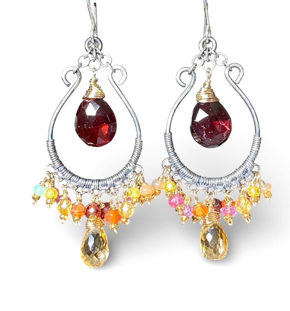 Red garnet and citrine briolette mixed metal chandelier hoop earrings on plain white background