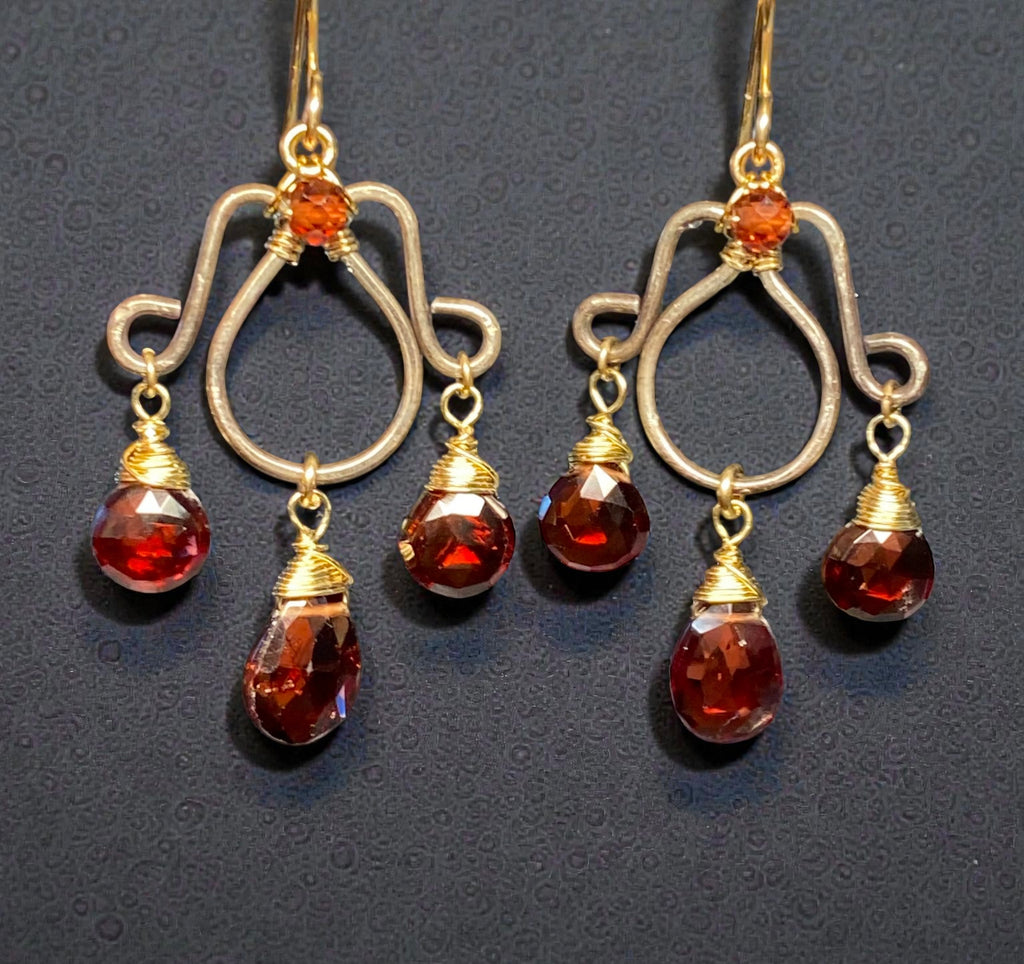  Oxidized silver chandelier earrings dangling red garnet faceted briolettes wire wrapped in 14kt gold fill wires shown against black background