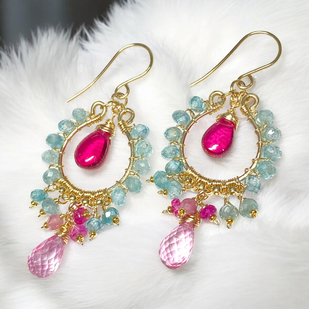 "Natural blue zircon and pink gemstone chandelier hoop earrings in 14K gold fill on white furry fabric"