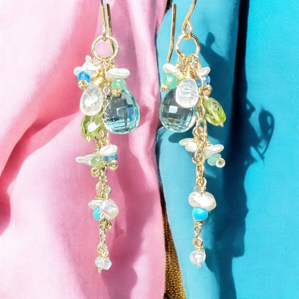 Earrings with colorful beads on a pink and blue background