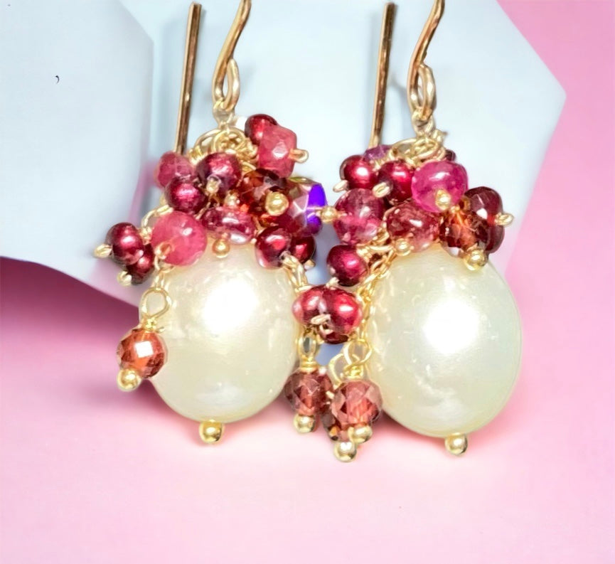 Red pearls, opals, and gemstones clustering over white pearls