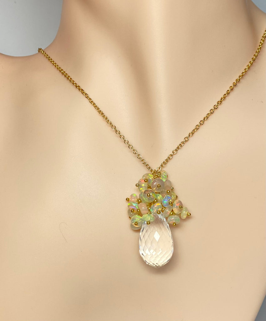 Lavish clusters of Ethiopian opals dangle over crystal quartz pendant on gold filled chain 20 inches long