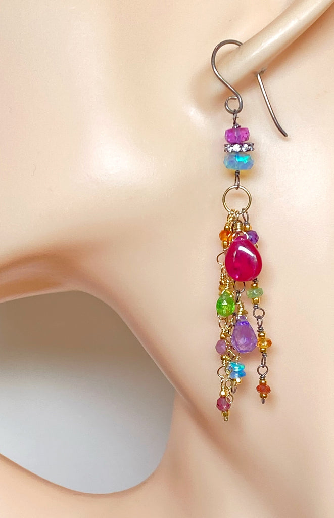 Multicolored beaded earrings on a mannequin ear