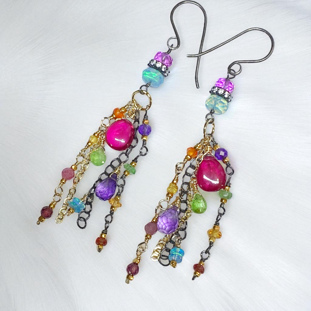Colorful beaded earrings on a white background