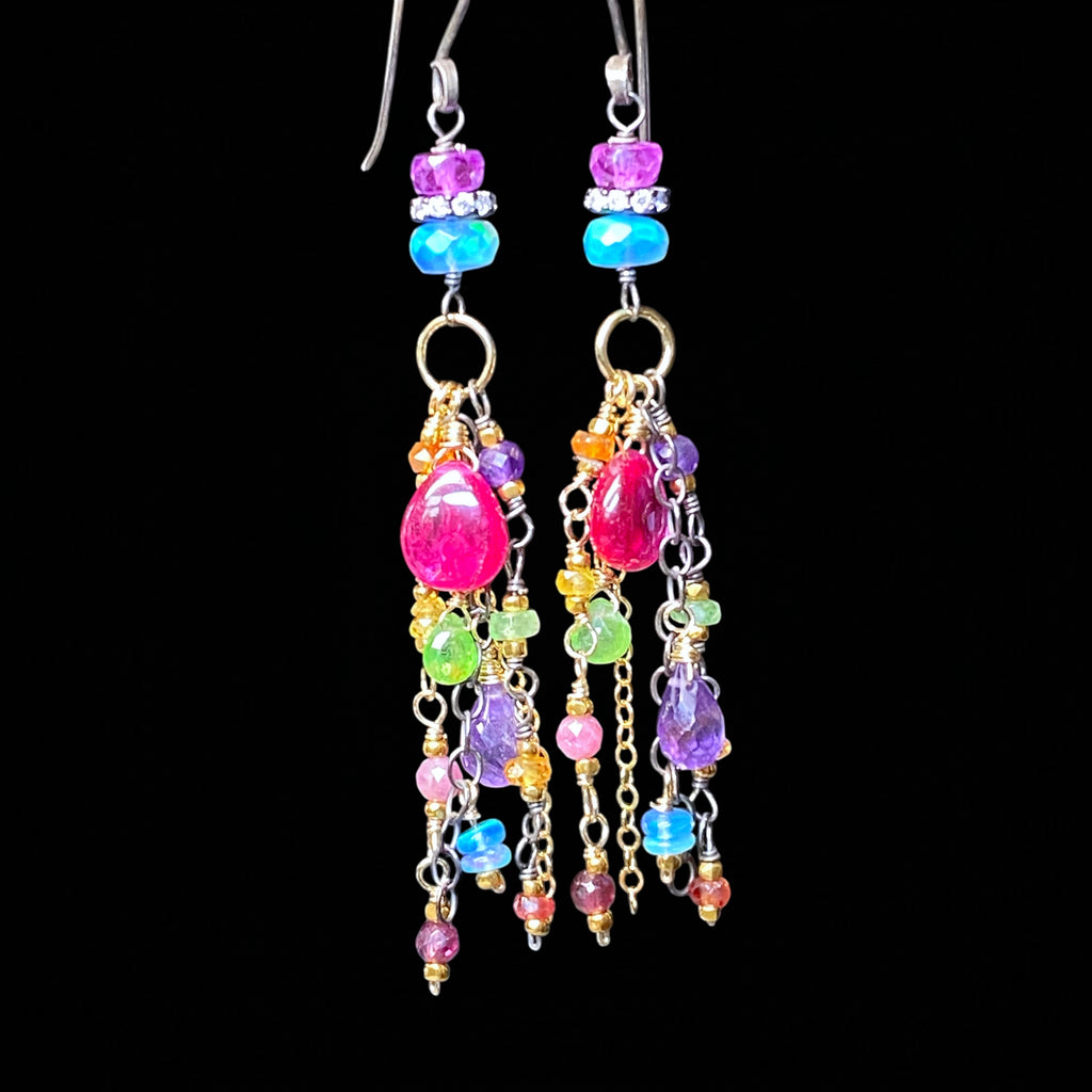 Colorful beaded earrings on a black background