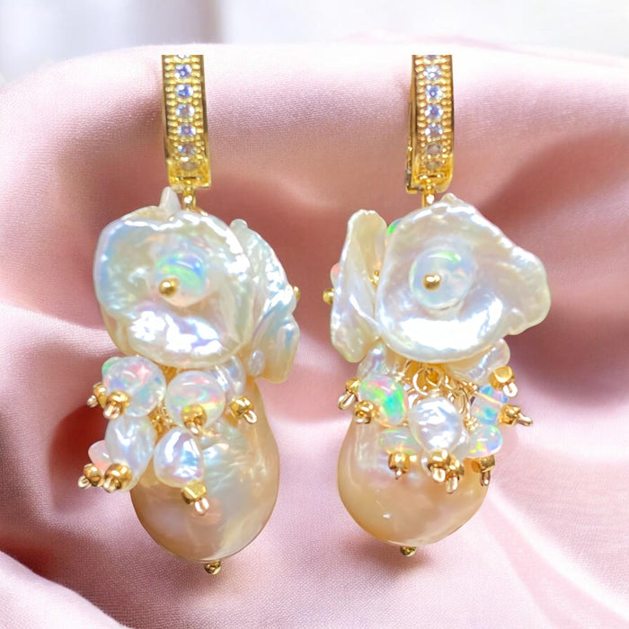 Pearl earrings with gold accents on a soft pink background