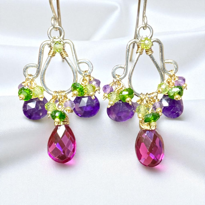 Jewelry set with teardrop-shaped gemstones on a white background