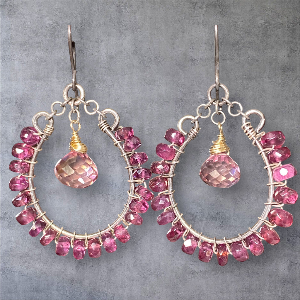 Rhodolite garnet hoop earrings mixed metals mystic plum pink topaz 14kt gold fill oxidized sterling silver against grey suede background