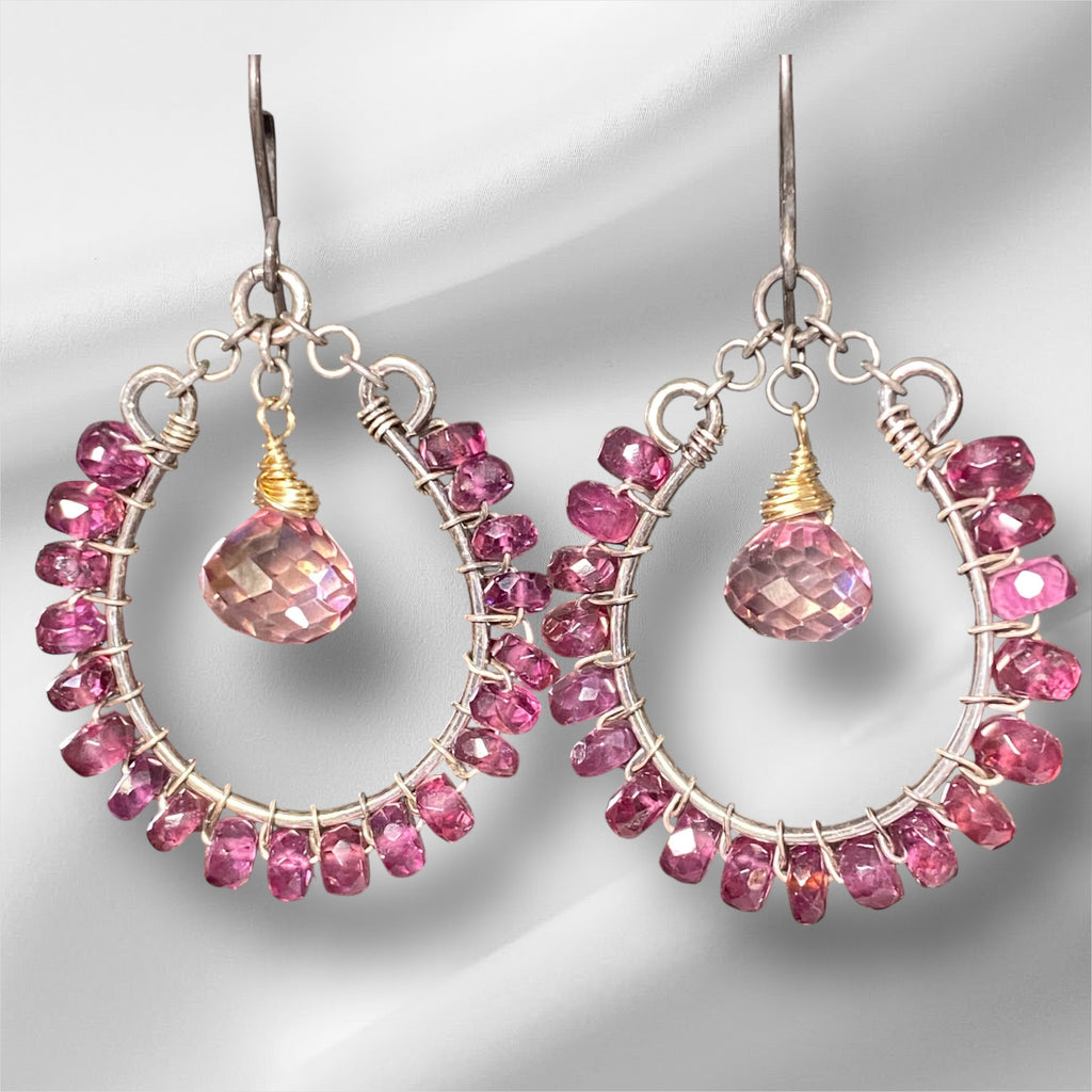 Rhodolite garnet hoop earrings mixed metals mystic plum pink topaz 14kt gold fill oxidized sterling silver against white draped fabric