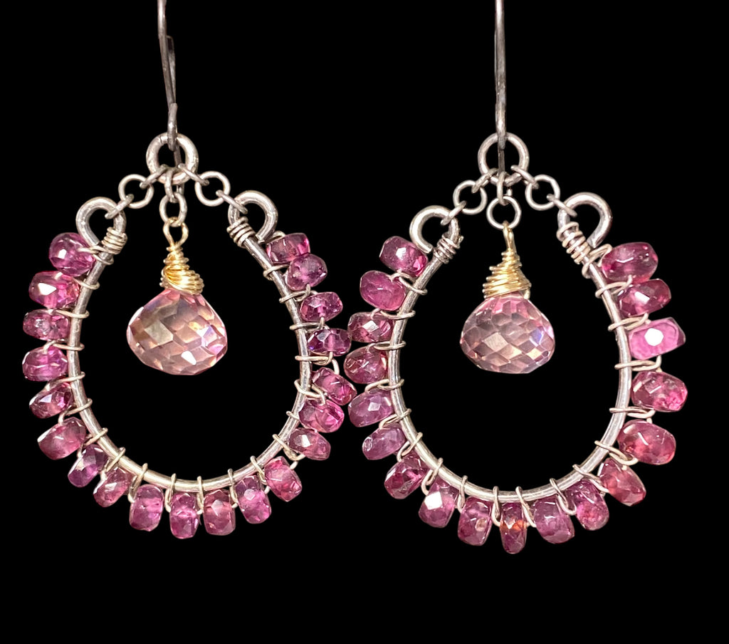 Rhodolite garnet hoop earrings mixed metals mystic plum pink topaz 14kt gold fill oxidized sterling silver against black backdrop