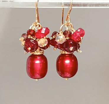 red freshwater pearl with red gemstone clusters in gold fill