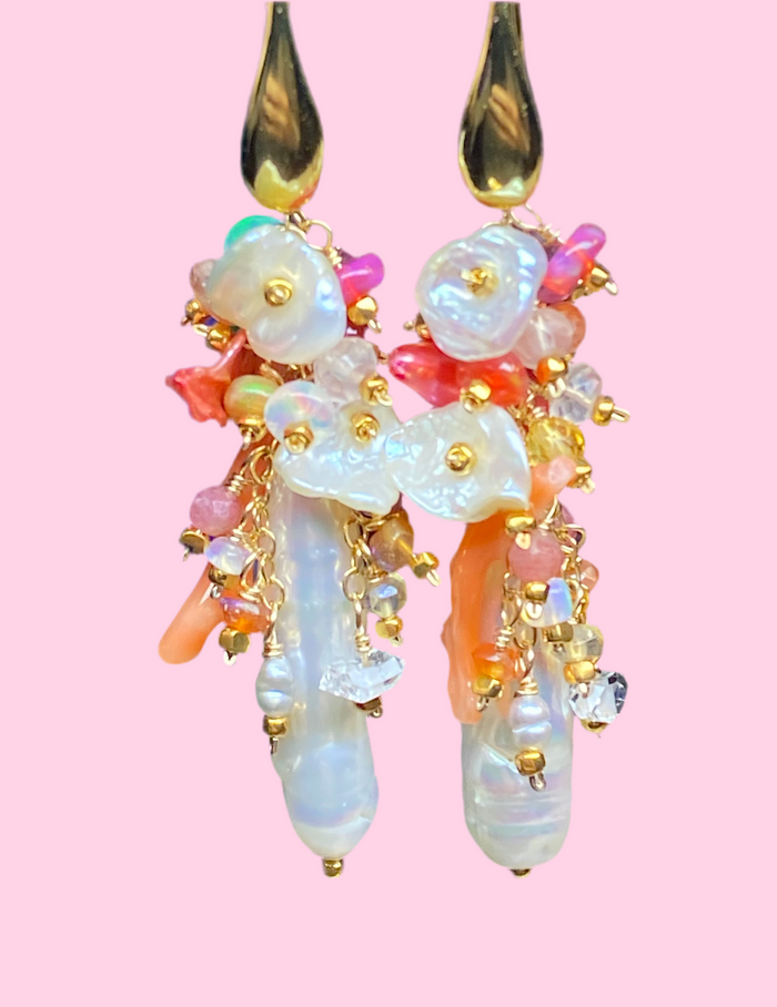 "White Biwa pearl and coral hot pink cluster earrings in sleek modern style on pink background"
