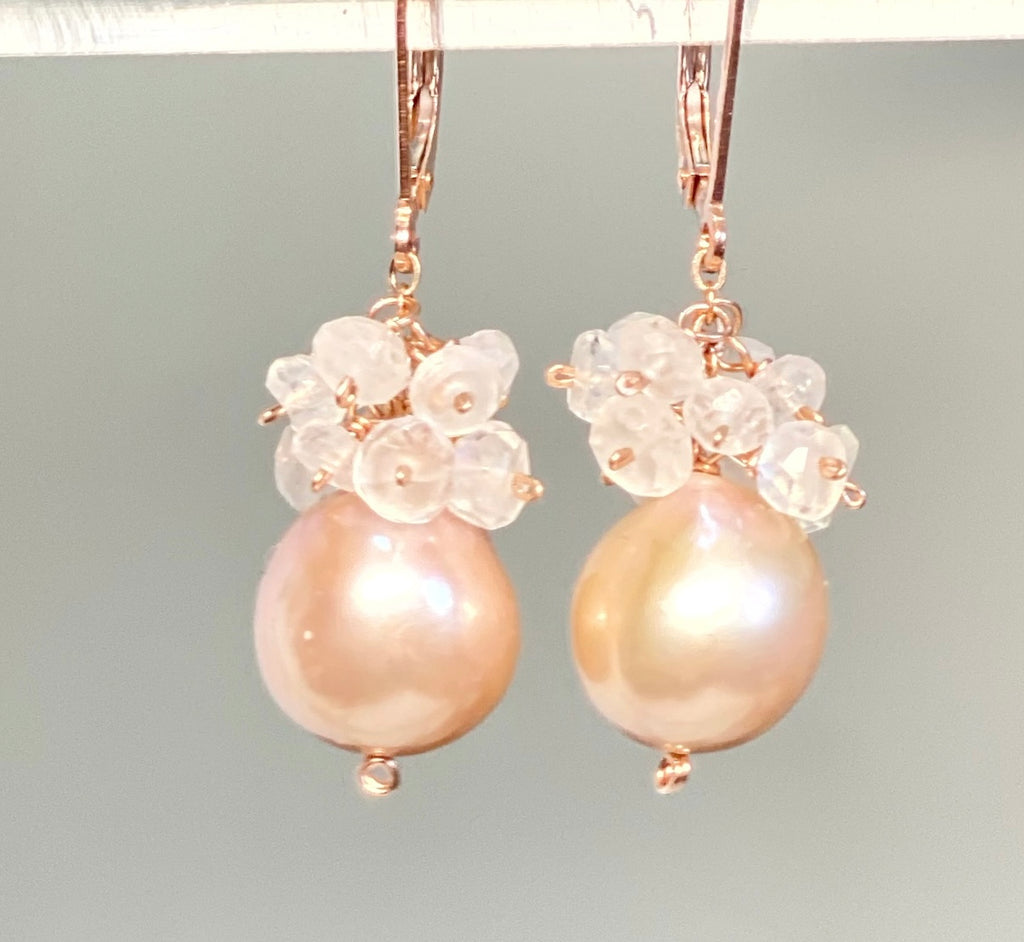 nearly perfectly round pink freshwater pearls dangle on rose gold filled wires with clusters of rainbow moonstones